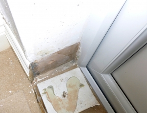 Dampness on wall caused by bridging